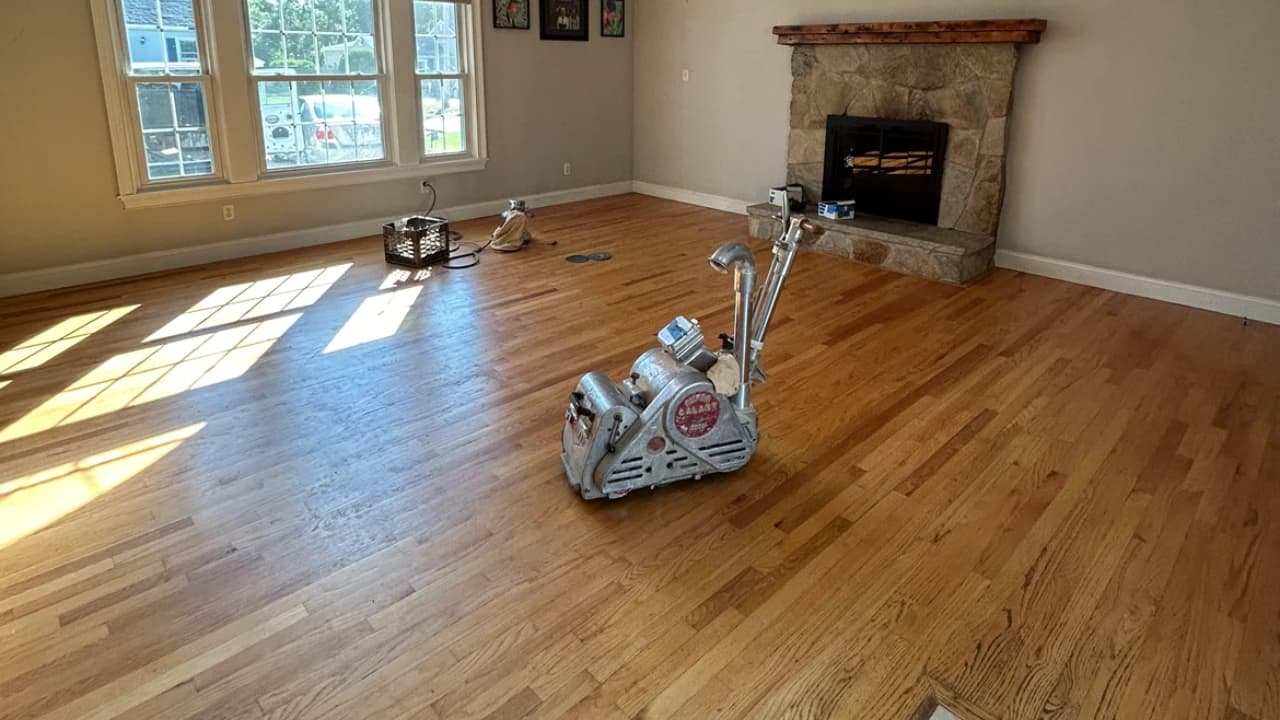 Polishing buffer working a refinished red oak floor, Kovich & Savard mid-job